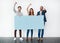 We absolutely love it. Studio shot of a diverse group of young people holding a blank placard and cheering against a