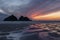 Absolutely stunning landscape images of Holywell Bay beach in Cornwall UK during golden hojur sunset in Spring