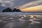 Absolutely stunning landscape images of Holywell Bay beach in Cornwall UK during golden hojur sunset in Spring