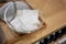 Absorbent cotton sheets in clear glass bowl on wood table