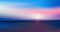 Abstract aerial panoramic view of sunrise over ocean. Nothing but blue bright sky and deep dark water. Beautiful serene scene.