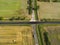 Abstract aerial picture of a crossroad of a country road with a country lane