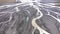 Abstract aerial top down view perspective of glacial melt water river streams in Iceland. Epic natural pattern landscape