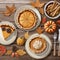 Abstract all sides dishes, pumpkin pie, fall leaves and seasonal autumnal decor on wooden background on digital art concept,