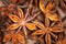 Abstract aniseed aromatic background. Anise stars condiment close up. Natural food texture