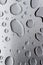 Abstract art background of large raindrops on stainless steel