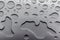 Abstract art background of large raindrops on stainless steel