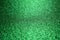 Abstract art background of sparkling bright green color glitter texture