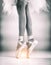 The abstract art design background of the lady legs with ballet shoes, standing with toes,for ballet basic pattern,vintage and art