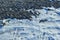 Abstract art texture background of a snow drifts along a farm field ditch