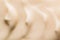 Abstract background of beige cosmetic cream