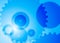 Abstract background with big and small gears blue color