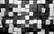 Abstract background of black and white random rotated cubes wall