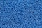 Abstract background of blue carpet or foot scraper or door mat.