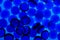 Abstract background from blue glass pebbles