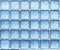 Abstract background of blue glass wall cubes.