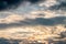 Abstract background, blue sky with dark cumulonimbus clouds.