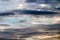 Abstract background, blue sky with dark cumulonimbus clouds.