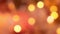 Abstract background of bright golden defocused bokeh lights