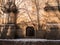 Abstract background of brown wall with shadows from trees Beautiful vintage wooden door wondow antique building exterior