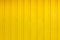 Abstract background corrugated gray metal for wall, material yellow paint