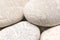 abstract background with dry round gray reeble stones gray close-up pebbles background spa relaxation concept