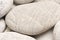 abstract background with dry round gray reeble stones gray close-up pebbles background spa relaxation concept
