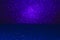 Abstract background filled with shiny ultraviolet glitter