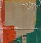 Abstract background. Fragment of brown cardboard transport packaging plastered with colored duct tape and polyethylene.