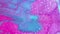 Abstract background glitter paint blue pink ink