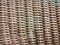 An abstract background image of a wiker basket with weathered colour