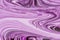 Abstract background for layouts. Unusual patterns close-up when mixing white and violet paint.