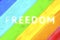 Abstract background LGBT rainbow with the inscription FREEDOM.