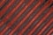 Abstract background with lines pattern, Velvet dark red fabric surface, stripes design, seamless canvas diagonal line