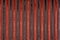 Abstract background with lines pattern, Velvet dark red fabric surface, stripes design, seamless canvas vertical line