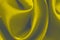 The abstract background is made of smooth elegant yellow silk satin. Close-up, random creases, selective focus