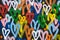 Abstract background with multicolored hearts painted with paint. The wall is brightly painted with a pattern in the form of hearts