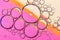 Abstract Background of Oil Bubbles on Water Surface pink salmon colorful palette