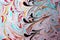 Abstract background of an oil painting with colorful swirly and wavy patterns