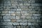 Abstract background of old cobblestone pavement. Grey stone brick paving texture. Close up of ancient road. Walking in an old city