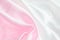 Abstract background - Pink and white satin textile