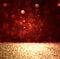 Abstract background of red and gold glitter bokeh lights, defocused