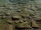 Abstract background of rocks underwater in a calm mountain lake