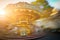 Abstract background. Rotating classic style carousel on Montmartre in backlit evening sunset sunbeam . Motion blur effect