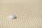 Abstract background of sand with white glass stone