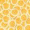 Abstract background with slices of fresh grapefruit. Seamless pattern for design. Close-up. Studio photography.