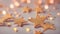 Abstract background with small shiny peach-colored stars. Generative AI.