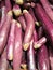 Abstract background of stacked purple eggplants