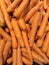 Abstract background of stacked ripe carrots