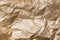 Abstract background texture golden shiny creased foil metal sheet